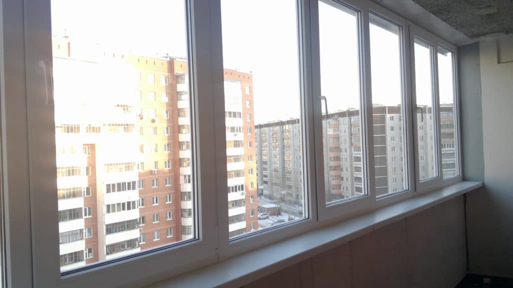 Остекление балкона окнами ПВХ без отделки
